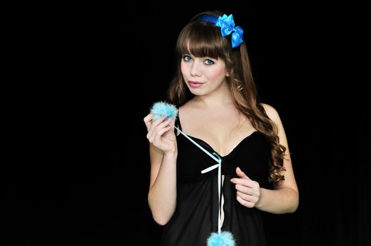 Blue-eyed pin-up sexy girl over black background