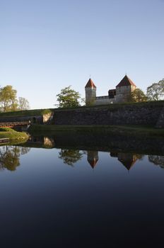 Medieval castle with reflection from the lake