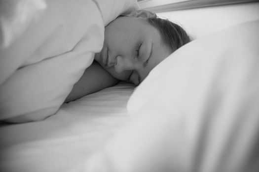 woman sleeping in pillows