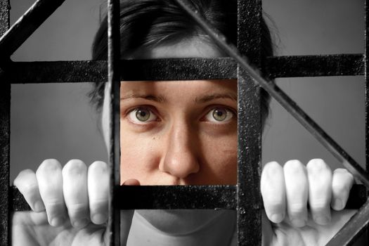 trapped woman behind iron bars