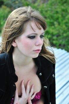 portrait of beautiful fashion girl over green