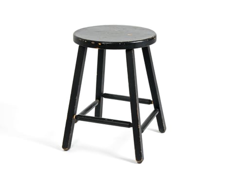 Painted black wooden stool on white background.