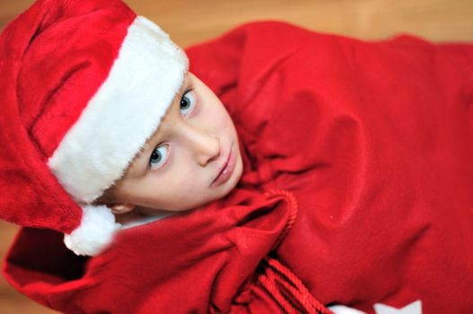 present from Santa - little Santa helper in red bag