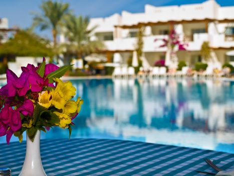 bunch of flowers on a table in the resort