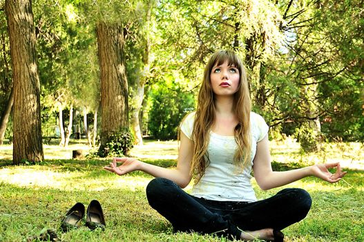 beautiful girl relaxing in the park after work