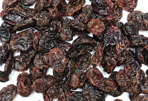 Black Jumbo raisins(very big raisins) over white background