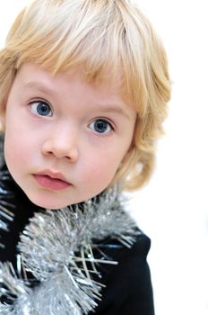 portrait of adorable little girl wearing new-year ornaments over white background