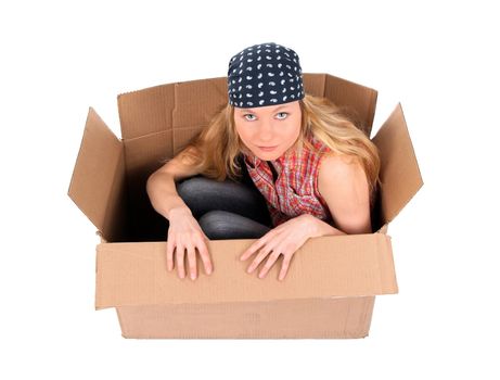 Cute girl sitting in a cardboard box, isolated on white.