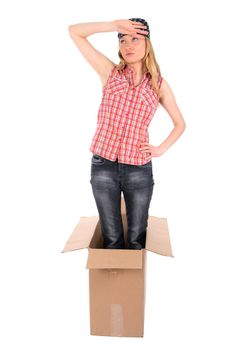 Tired girl standing in a cardboard box. Isolated on white.