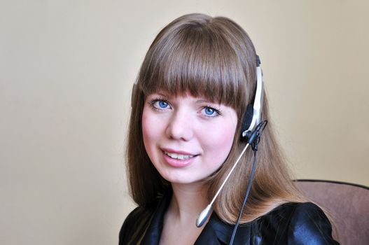 smiling blue-eyed girl operator with head set