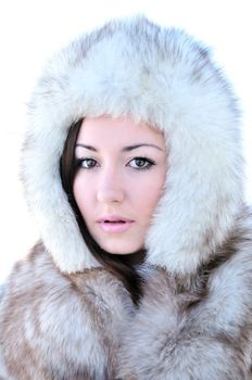 sensitive girl in fur over the white