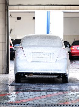  washing Cars at the Car-wash service
