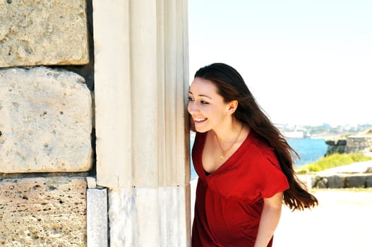 brunette in the ancient town has seen something funny