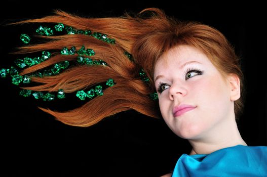  head of girl with natural red hair over black.