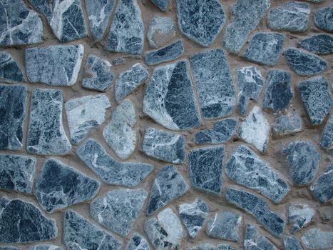 A close-up of textured stone wall