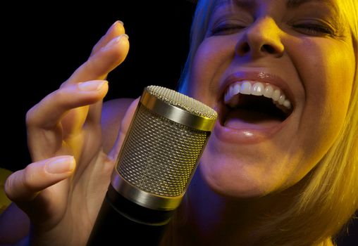 Woman with Microphone Sings with Passion