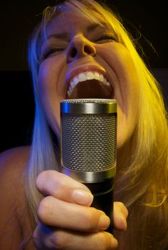 Woman with Microphone Sings with Passion