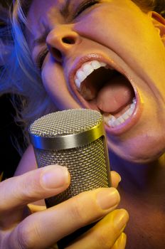 Woman with Microphone Sings with Passion