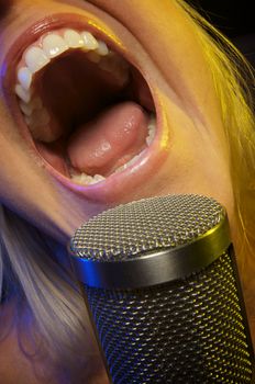 Woman with Microphone Sings with Passion