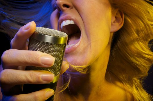 Woman with Microphone Sings with Passion