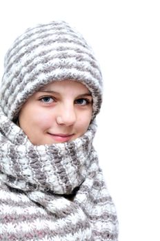 pretty teenage girl wearing wool hat and scarf over the white