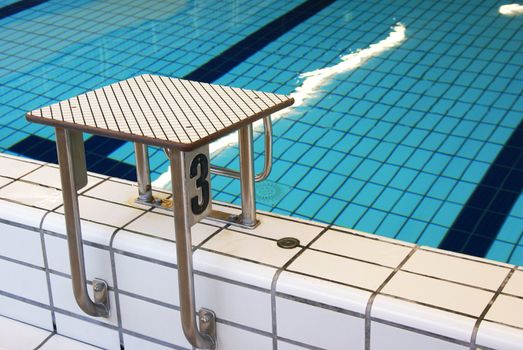 Starting block in an indoor swimming pool.