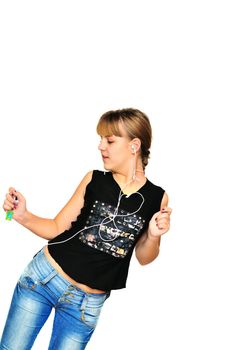  teenager girl listening mp3 player and dancing over white
