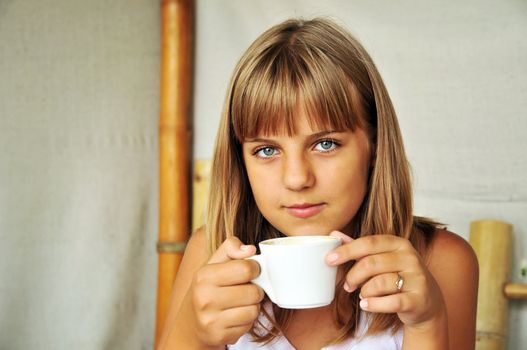 teen pretty girl with cup of coffee 