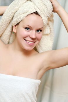  young beautiful woman after bath wearing towels
