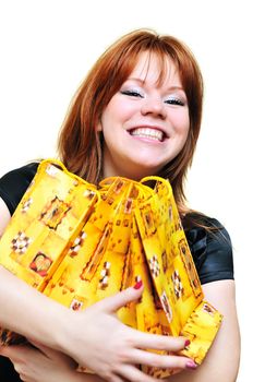 redheaded laughing girl after shopping over the white

