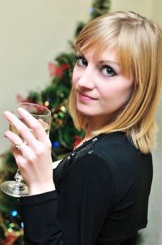 beautiful slim blonde girl with glass of wine

