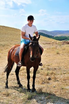 Man riding a horse, focus is on the horse's face
