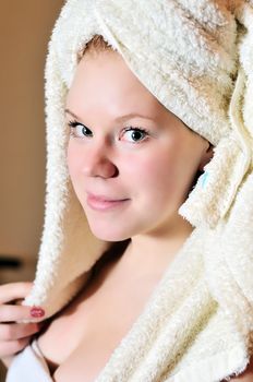 young beautiful woman after bath wearing towels
