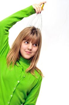 Teen girl enjoying using  head scalp massage