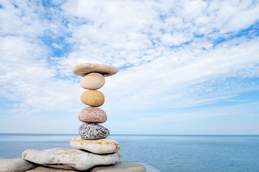 Pile of pebble on background cloudy sky