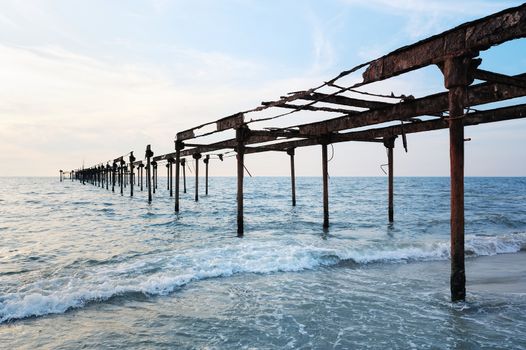 Old iron bridge is removed in the sea