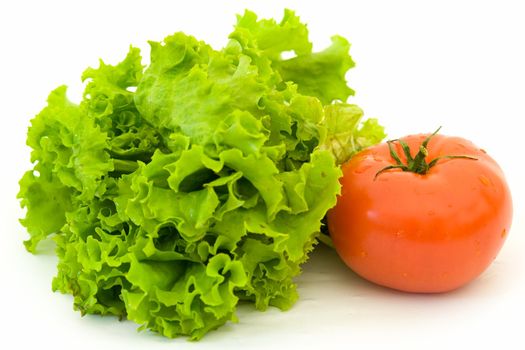 Lettuce and red tomato on a white background