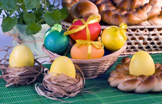 Colour eggs in  basket and eggs Easter wreath