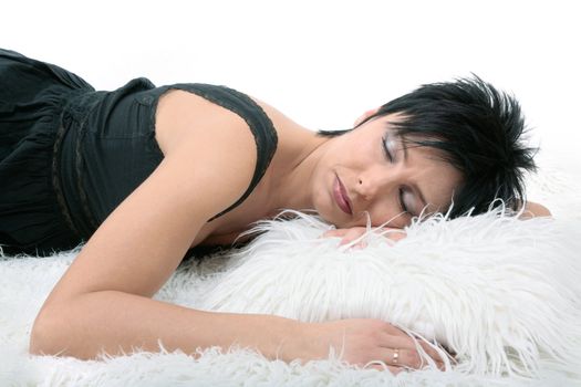young beautiful woman sleeping on white pillow