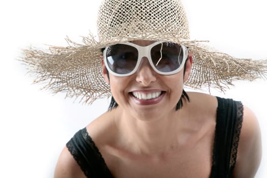 smiling young woman with sunglasses and hut