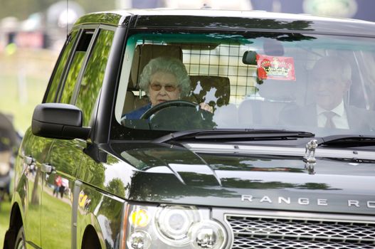 Elizabeth II driving her car