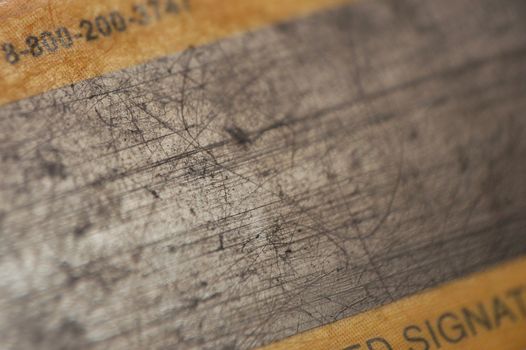 macro pattern of pretty used magnetic strip of credit card with scratches