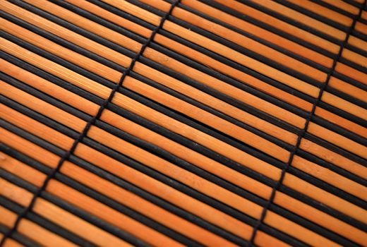macro pattern of yellow and black bamboo mat