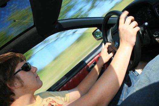 driver in his car, speed