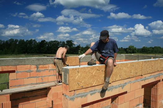 workers on the building, height