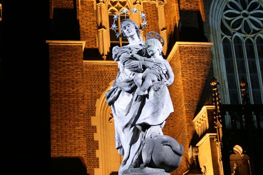 St. Marie and the Jesus child, cathedral in the background