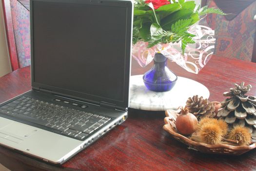 laptop on the table with flowers