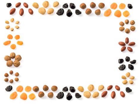 A frame of dried fruits: almonds, prunes, apricots, walnuts, pecans and hazelnuts.