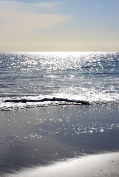 Sparkles of Pre-Sunset Light on Calm Ocean Waves. Grange, Adelaide, Australia