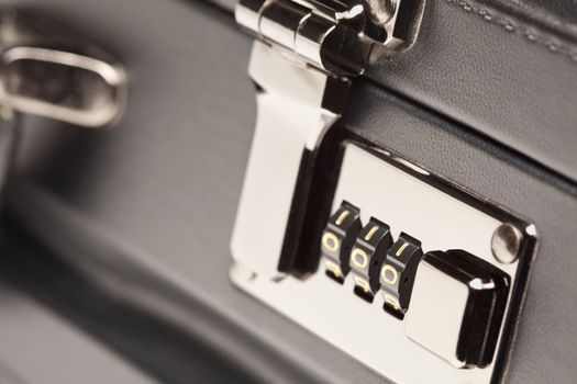 Abstract Close Up Shot of a Black Leather Briefcase Latch and Lock.
